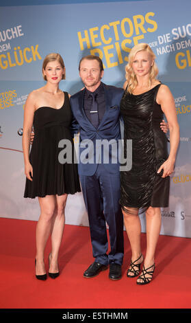 Berlin, Germany. 05th Aug, 2014. Actors Rosamund Pike (L-R), Simon Pegg and Veronica Ferres arrive for the premiere of the film 'Hector and the Search for Happiness' at Zoo-Palast in Berlin, Germany, 05 August 2014. The film comes to German cinemas on 14 August 2014. Photo: Joerg Carstensen/dpa/Alamy Live News Stock Photo