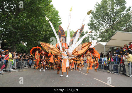 Notting Hill Carnival participants wearing traditional Caribbean costumes Stock Photo