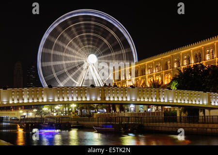 SHARJAH, UAE - OCTOBER 29: Ferris wheel in Al Qasba. Sharjah - third largest and most populous city in United Arab Emirates, on Stock Photo