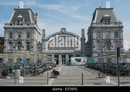 Plenty of bicycles fill the storage racks in front of railway stationOstend . The station was opened in 1913. Stock Photo