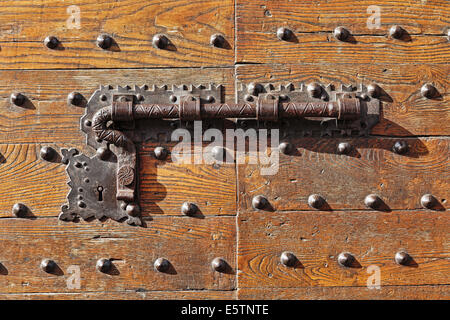 Old door lock on a wooden door Stock Photo