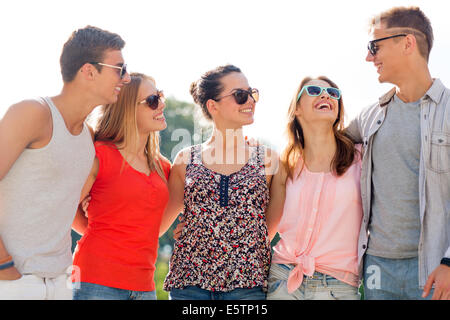 group of smiling friends in city Stock Photo