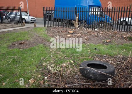 Tyre Tire Dumped on Waste Ground Illegal Fly Tipping Stock Photo