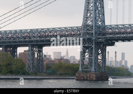 The Williamsburg Bridge, which opened in Dec. 1903, connects the Lower East Side of Manhattan with Williamsburg, Brooklyn. Stock Photo