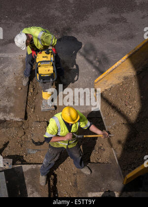 UK Roadworks Repair and replacement of underground water mains pipework by contractors - Amey Stock Photo