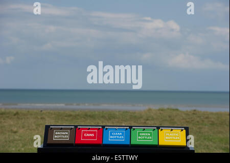County Louth, Ireland. 6th Aug, 2014. Weather:  Colourful recycling bins on Port beach, County Louth. Credit:  Barry Cronin/Alamy Live News Stock Photo