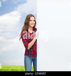 smiling young teenage girl with white blank board Stock Photo