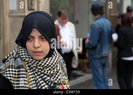 Manchester, UK 6th August, 2014.  Musilm woman and Pro-Palestine and Pro-Israeli protesters demonstrate outside Kedem on King Street in Manchester city centre.  Pro-Palestine demonstrators have been protesting at the site since last Saturday, saying it is part of a wider campaign to boycott produce from Israel.   Since then a counter-demonstration has been set up.   Credit:  Mar Photographics/Alamy Live News Stock Photo