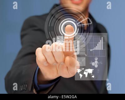 businessman in suit pressing virtual button Stock Photo