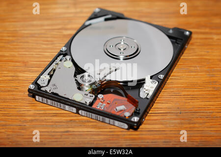 Opened hard drive showing disc platter. Stock Photo