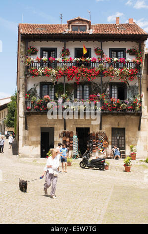 Traditional house with hanging baskets and flowers Santillana del Mar, Cantabria, Northern Spain, Europe Stock Photo