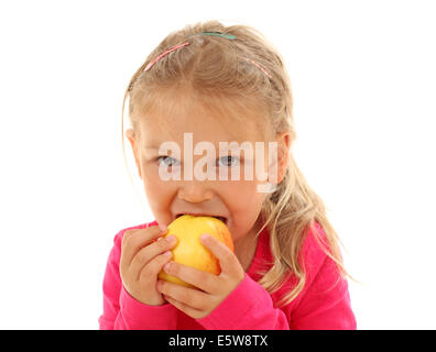 Little girl bites in an apple Stock Photo