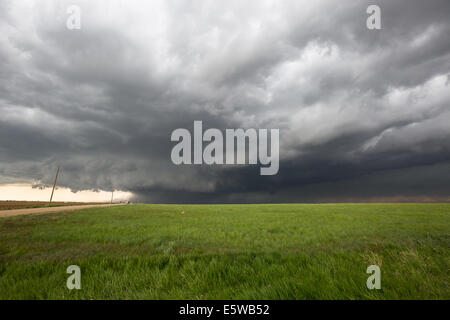 A tornado warned supercell thunderstorm rolls across the plains of Colorado producing various severe weather Stock Photo