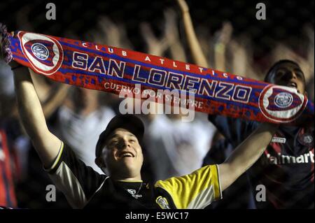 Asuncion, Paraguay. 6th Aug, 2014. Fans of San Lorenzo react prior to the first-leg final match of the 2014 Libertadores Cup between Nacional and San Lorenzo, held at Defensores del Chaco Stadium, in Asuncion, Paraguay, on Aug. 6, 2014. Credit:  Jose Romero/TELAM/Xinhua/Alamy Live News Stock Photo