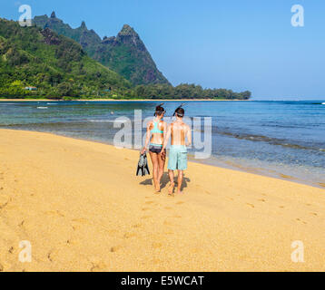 Snorkelers at Tunnels Beach on Kauai, with Mt. Makana, called Bali Hai, in background Stock Photo