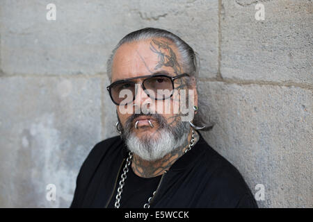 Berlin, Germany. 05th Aug, 2014. Berghain doorman Sven Marquardt poses at Volksbuehne theater in Berlin, Germany, 05 August 2014. Berlin cult club Berghain celebrates its ten year anniversary with an exhibition. Part of the exhibition are photographs of the legendary and feared doorman. Photo: Joerg Carstensen/dpa/Alamy Live News Stock Photo