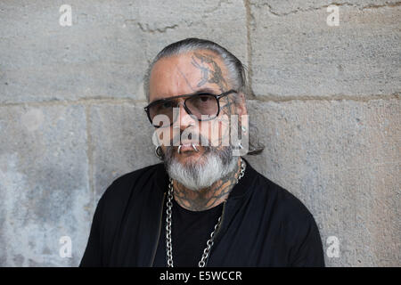 Berlin, Germany. 05th Aug, 2014. Berghain doorman Sven Marquardt poses at Volksbuehne theater in Berlin, Germany, 05 August 2014. Berlin cult club Berghain celebrates its ten year anniversary with an exhibition. Part of the exhibition are photographs of the legendary and feared doorman. Photo: Joerg Carstensen/dpa/Alamy Live News Stock Photo