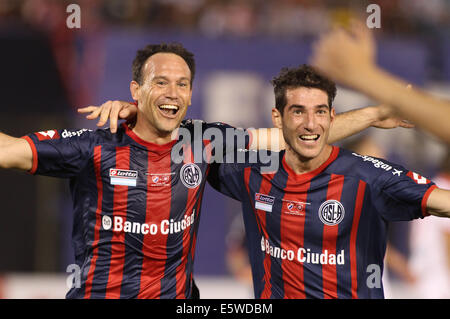Asuncion, Paraguay. 6th Aug, 2014. Mauro Matos(L) of San Lorenzo celebrates after scoring during their first-leg final match of the 2014 Libertadores Cup against Nacional at Defensores del Chaco Stadium, in Asuncion, Paraguay, on Aug. 6, 2014. Credit:  Str/Xinhua/Alamy Live News Stock Photo