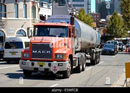 Large articulated tanker truck (semi-trailer) on an urban road Stock Photo
