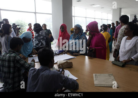 Dhaka, Bangladesh. 7th Aug, 2014. Garments worker of Tuba Group were seen at the BGMEA office on Thursday collecting their partial dues.Worker get 2 month Salary & wages, and Eid festival bonus. Credit:  Zakir Hossain Chowdhury/ZUMA Wire/Alamy Live News Stock Photo