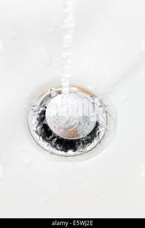 Water splashing in a sink Stock Photo