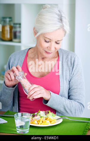 Elderly people eating a meal Stock Photo