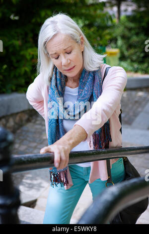 Lower back pain in elderly person Stock Photo