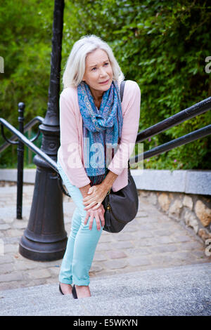 Tired elderly person Stock Photo