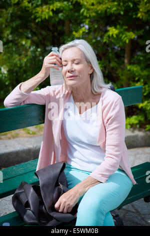 Warm weather, elderly person Stock Photo