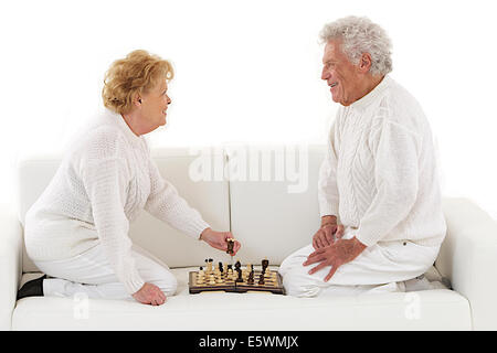 ELDERLY PEOPLE PLAYING CHESS Stock Photo