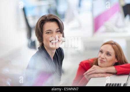 Female office worker smiling Stock Photo
