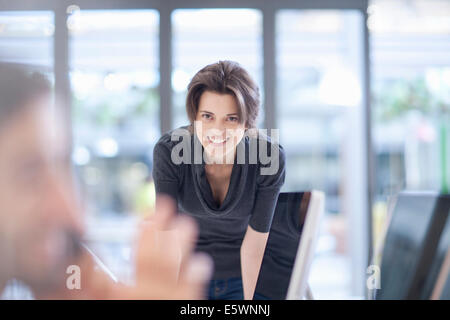 Female office worker smiling, portrait Stock Photo