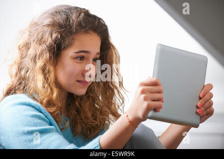 Young girl using digital tablet Stock Photo