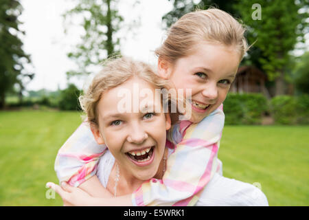Two sisters hugging, portrait Stock Photo