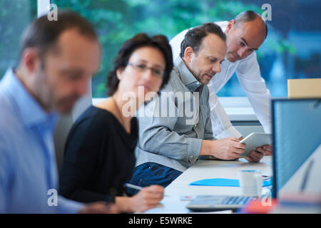 Businesspeople working in office Stock Photo