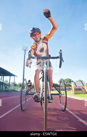 Cyclist at finishing line in para-athletic competition Stock Photo