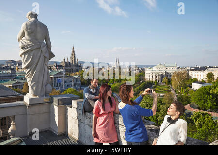 Group of young adult tourists taking pictures, Vienna, Austria Stock Photo