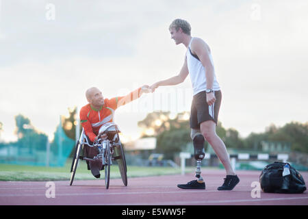 Para-athletes doing fist bump Stock Photo