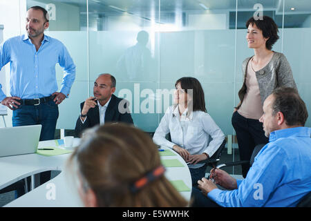 Informal business meeting around boardroom table Stock Photo