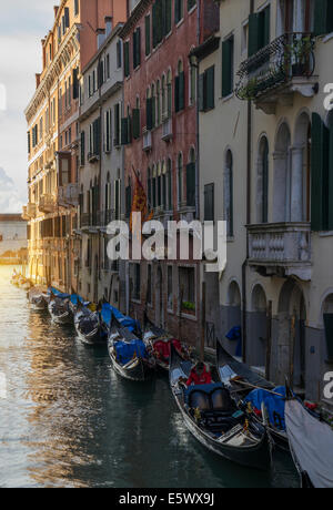 A row of gondolas and the Island of San Giorgio, Venice, Veneto, Italy