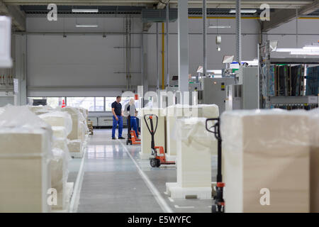 Two workers in paper packaging factory Stock Photo