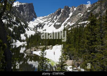 Hikers along Dream Lake in Rocky Mountain National Park, Colorado Stock Photo