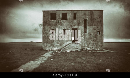 Aged photo of a bleak and scary haunted house Stock Photo