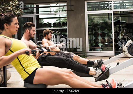 Bodybuilders on rowing machine outdoors Stock Photo - Alamy