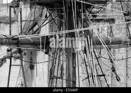 Black and white image of the yardarms and rigging on a old sailing ship Stock Photo