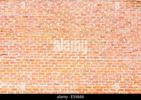 Background of red bricks wall with cement Stock Photo