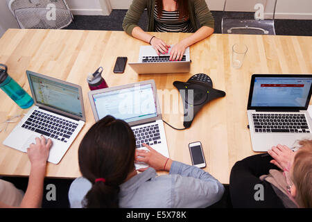 High angle view of women working on laptops Stock Photo