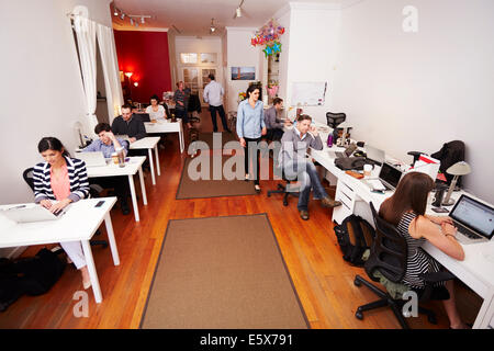 People at work in busy modern office Stock Photo