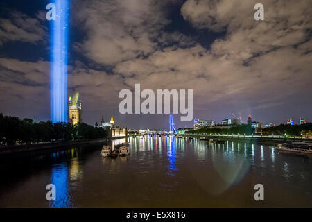 London, UK. 4th August, 2014. The London light installation for LIGHTS OUT looms above Westminster - it was designed to be able to be seen across the city and appeared at 10 pm as part of a series of art commissions. 14-18 NOW, the official cultural programme for the WW1 centenary commemorations, has organised a number of events to mark the centenary. As part of that, LIGHTS OUT is a nationwide event which are taking place at hundreds of venues, churches, war memorials and iconic buildings across the country on 4 August between 10pm and 11pm. Credit:  Guy Bell/Alamy Live News Stock Photo