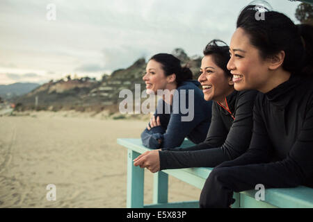 Joggers enjoying view on beach Stock Photo